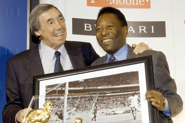 Gordon Banks (left) with a picture of his famous save from Brazil striker Pele (right). Brazil great Pele has died at the age of 82, his family have announced on social media. Stefan Rousseau/PA Wire.