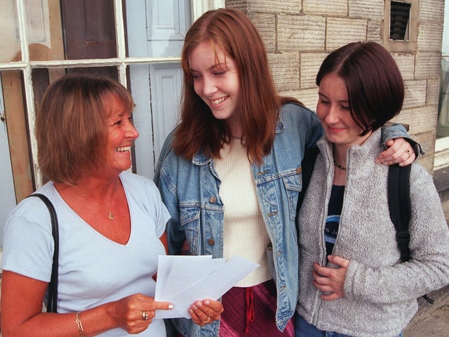 Students Emily Bainbridge and Amber Kirby at Sheffield's King Edward VII School on A level results day, with post-16 teacher Mrs Susan Holden