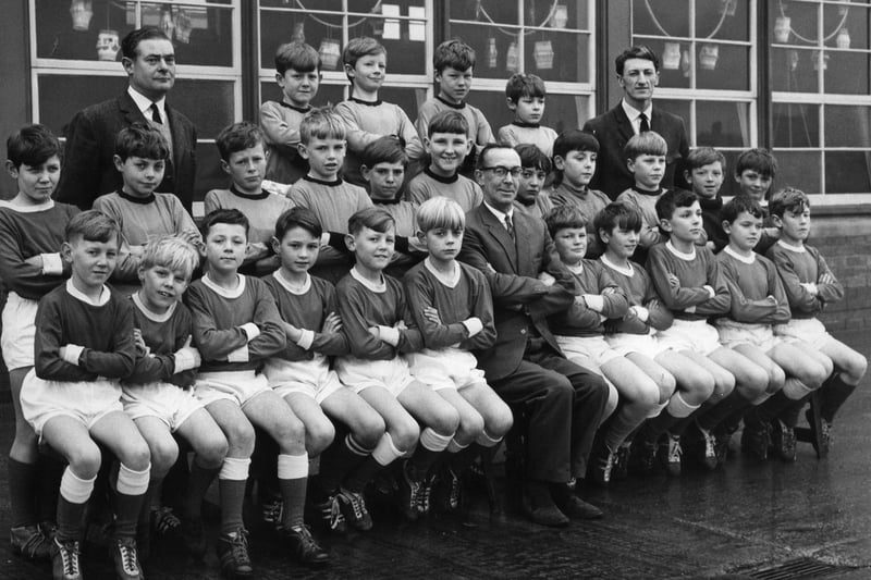 Harton Junior Boys with their football coaches - A Bragg, left and J S Smith, right in 1966. The man seated at the front is headmaster T Hewitt. Can you spot anybody else that you know?