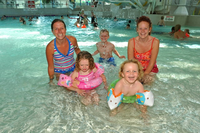 August 2010. Kate Fraiser (back right with her sons Liam (8,back) and Jude (4, front right) with Carly Allen (left) and her daughter Lily (4,front right) enjoying themselves at The Pyramids in Southsea which re-opened under new management. Picture: Steve Reid 102444-43
