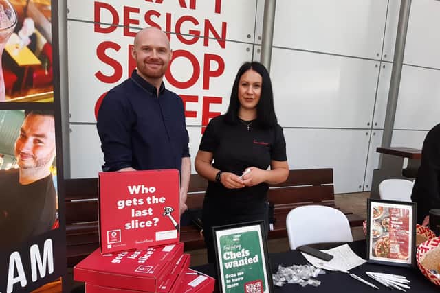 Scott Hesford and Chloe Tindall recruiting for The Restaurant Group at the jobs jamboree for the hospitality industry at the Wintergarden, Sheffield