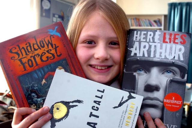 Ten year old Abbi Le-Finch a pupil at Edenthorpe Hall Primary School in 2007. Pictured with books she's going to read and judge.