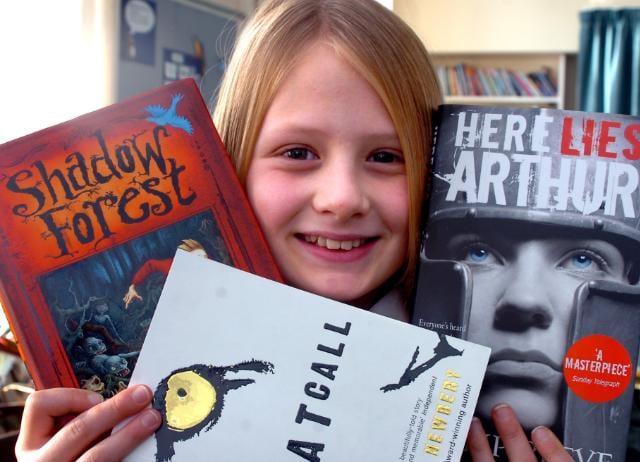 Ten year old Abbi Le-Finch a pupil at Edenthorpe Hall Primary School in 2007. Pictured with books she's going to read and judge.