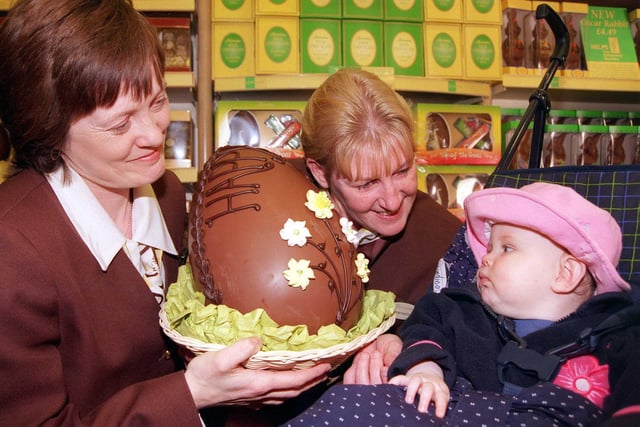 in 1999 Thornton's Sally Dawson and Jeanette Lowe show Sian Noble, aged nine months one of the shop's giant Esater Eggs
