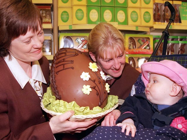 in 1999 Thornton's Sally Dawson and Jeanette Lowe show Sian Noble, aged nine months one of the shop's giant Esater Eggs