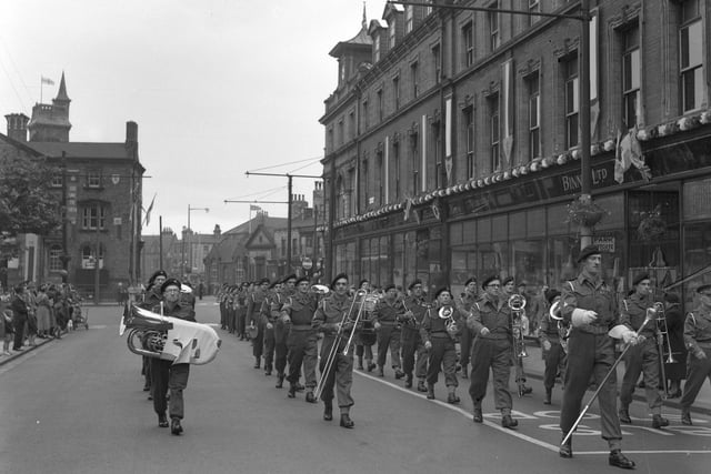 A Military band parade passing Binns in Victoria Road. Can anyone guess at the year?