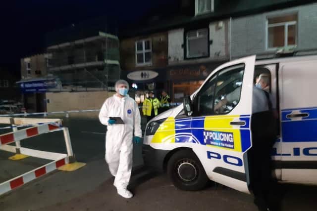 Police scene of crime officers on the scene at a reported stabbing in Crookes, Sheffield. Police have now confirmed they are investigating the murder of a teenager