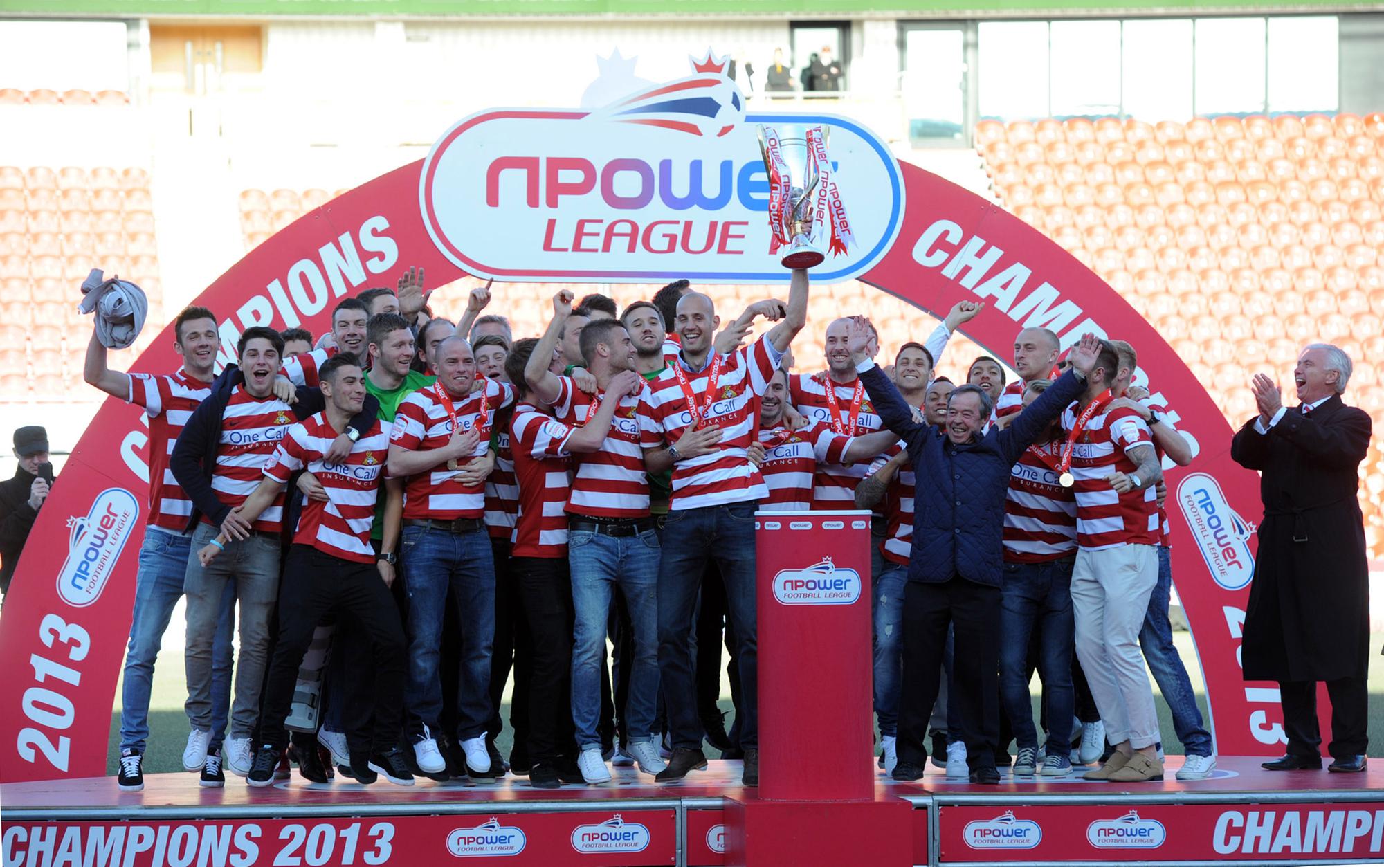 Rovers celebrate with the League One trophy