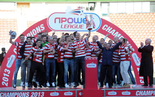 Rovers celebrate with the League One trophy