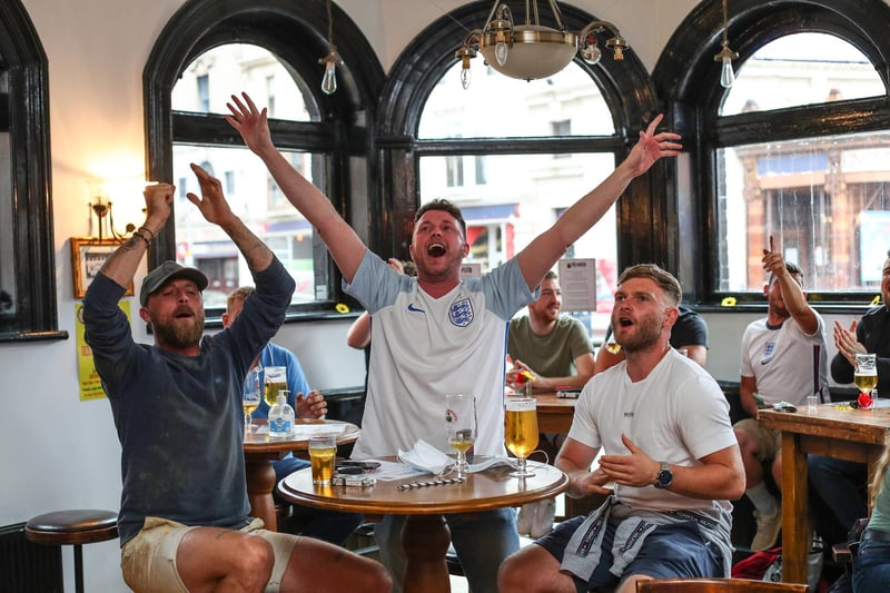 Fans pictured in The Kings pub celebrating on the final whistle. Picture: Stuart Martin (220421-7042)