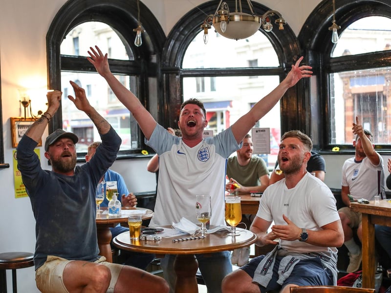 Fans pictured in The Kings pub celebrating on the final whistle. Picture: Stuart Martin (220421-7042)