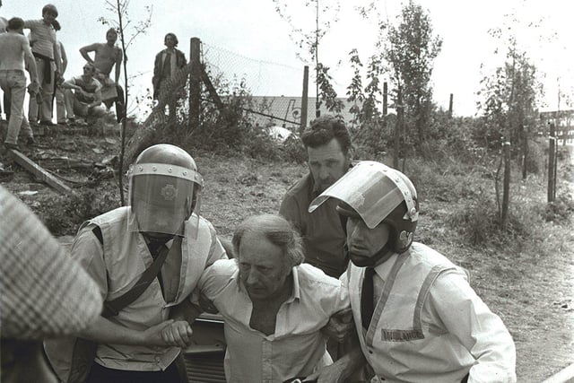 Miners Strike June 18th 1984 and Leader Arthur Scargill is carried from Orgreave by ambulancemen.
