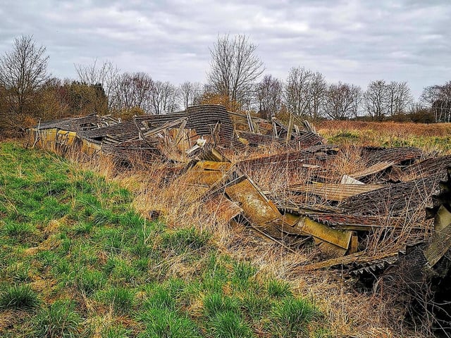 A former outbuilding has completely fallen down.