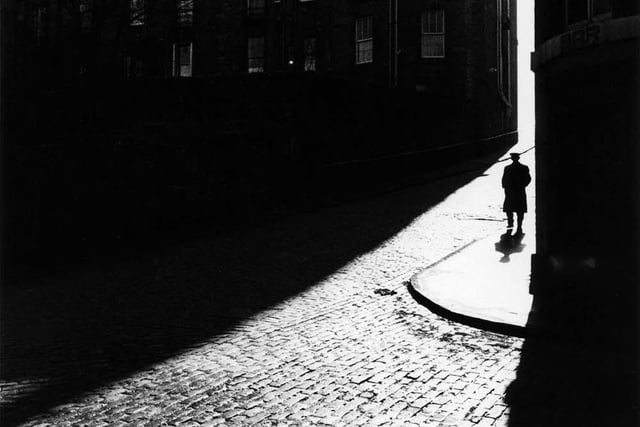 Long shadows and a lone figure at India Place.