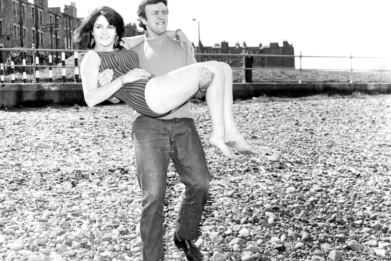 British actress Diana Quick, in Edinburgh for the Festival, on her way to take a dip in the sea at Portobello in August 1966.