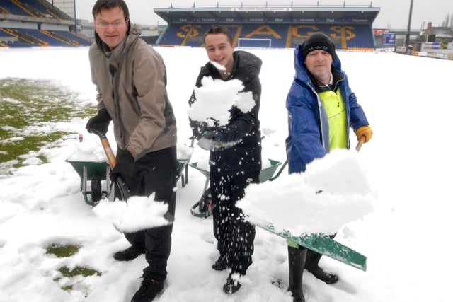 Stags fans Roger Stephenson, Daniel Worthington John Vardy  helped clear the snow at Field Mill  in 2010