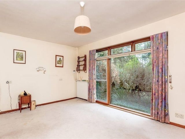 The sun room is a accessed from the dining room and has a sliding door leading out to the rear garden and patio