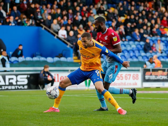 Jordan Bowery holds off Scunthorpe defender Emmanuel Onariase