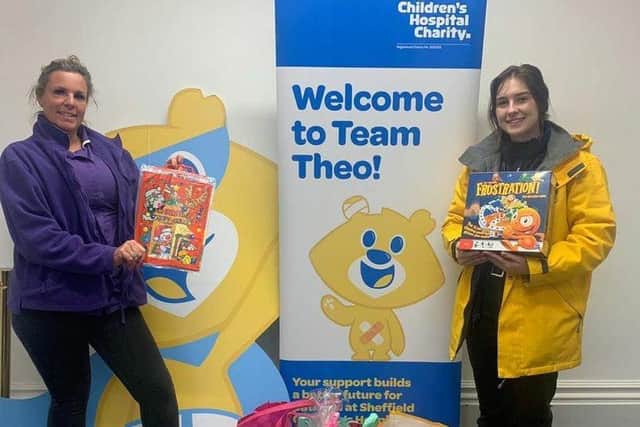 Rebecca (left) presented gifts to the Children's Hospital Charity