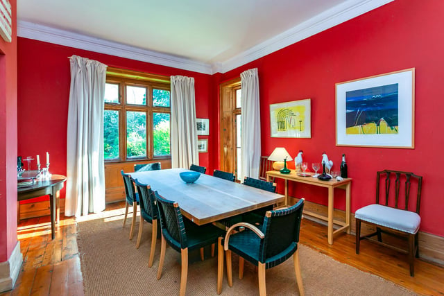 The formal dining room is both spacious and bright, with hardwood floors, large windows overlooking the gardens and enough room to entertain guests.