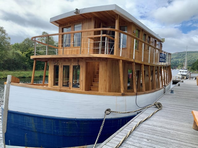 Highland Lassie is a sympathetic conversion of a former fishing boat, moored on the Caledonian Canal in the picturesque village of Dochgarroch, near Loch Ness, and just five miles from the Highland capital Inverness.