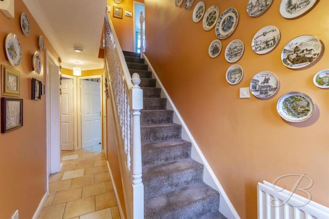 The hallway gives access to all the main rooms on the ground floor, as well as a toilet with low-flush WC and pedestal wash basin. It also directs us upstairs to a carpeted landing that leads to the four bedrooms.
