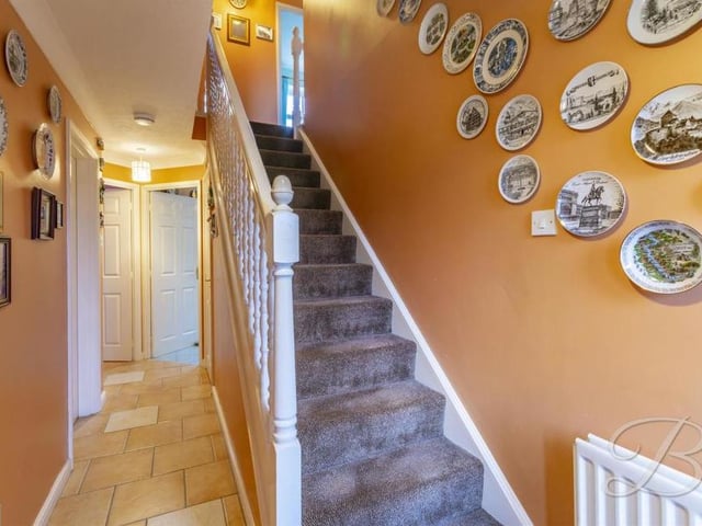 The hallway gives access to all the main rooms on the ground floor, as well as a toilet with low-flush WC and pedestal wash basin. It also directs us upstairs to a carpeted landing that leads to the four bedrooms.