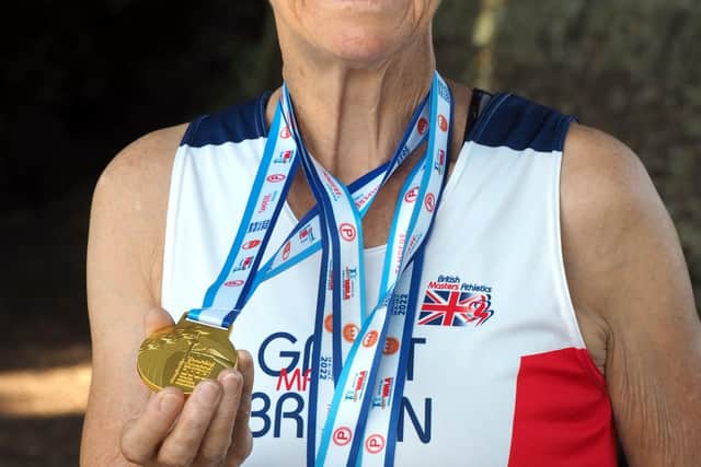 World W70 10K Champion Dot Kesterton with her World Masters medals.