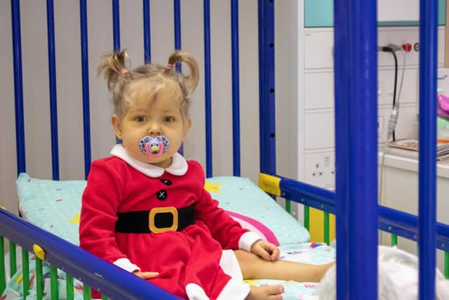 A child dressed up for Christmas at Sheffield Children's Hospital