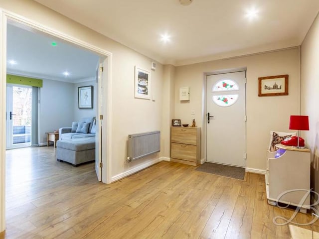 The entrance hallway is spacious and welcoming. It leads to both the kitchen and the living/dining room, and opposite the front door are stairs that take you to the first floor and the bedrooms.