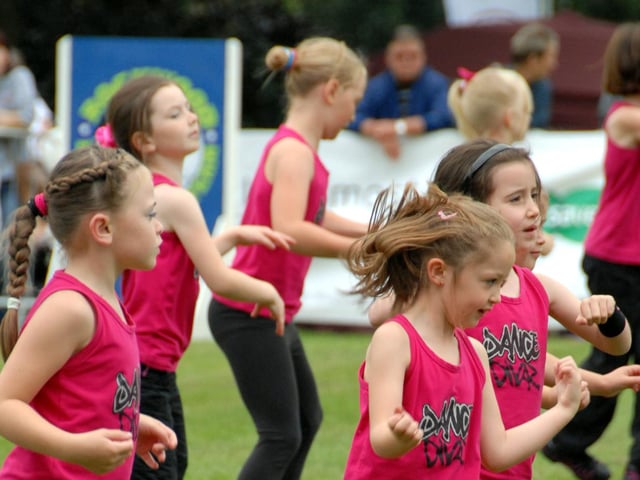 Dance Divaz performing in front of the large crowd.
