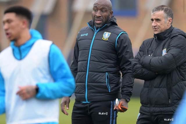 Sheffield Wednesday manager Darren Moore talks things over with coach Neil Thompson.