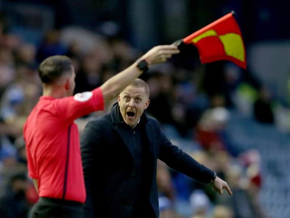 SHEFFIELD, ENGLAND - DECEMBER 07:  Gary Monk manager of Sheffield Wednesday reacts with the Assistant refereee during the Sky Bet Championship match between Sheffield Wednesday and Brentford at Hillsborough Stadium on December 7, 2019 in Sheffield, England. (Photo by Nigel Roddis/Getty Images)