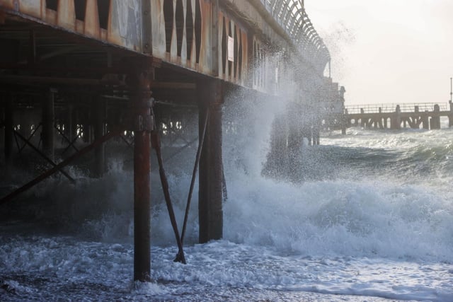 South Parade Pier saw large waves crashing against it. Photos by Alex Shute