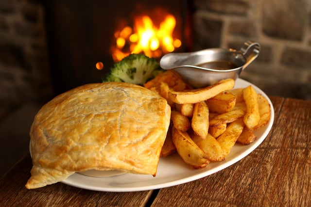 Cosy inn with timber beams and fires, serving hearty pub food.