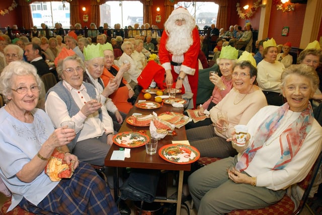 The Fulwell Neighbourhood Watch Christmas party got a visit from Santa in 2003. Were you there?