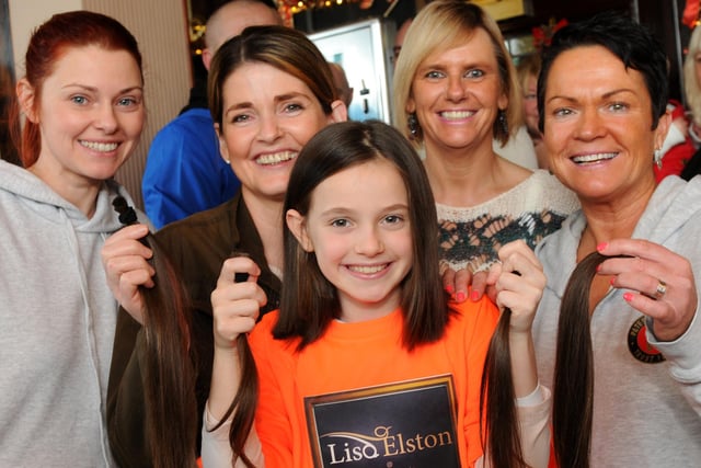 A Sunderland scene as nine-year-old Orla Taylor had her long hair cut for charity. She is pictured with, left to right,  hair stylist Lisa Elston, mum Debbie, Jeanette Taylor, landlady of The Landsdown and Julie Reay.