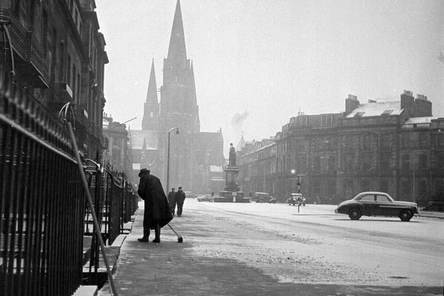 A resident clears pavement in Melville Street on 15 November, 1962