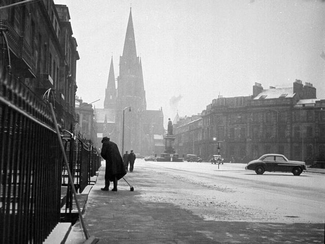 A resident clears pavement in Melville Street on 15 November, 1962