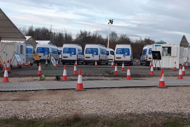 Eight mobile testing unit vans could be seen parked up.