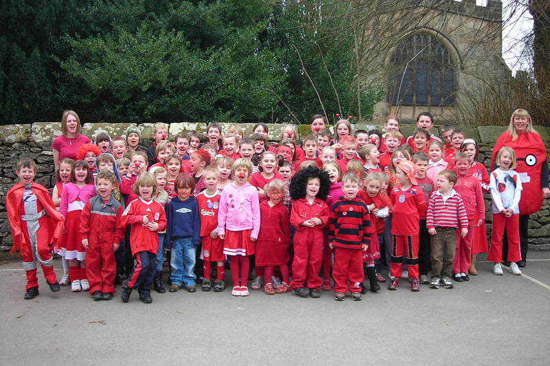 Children at Youlgrave All Saints' Primary come to school in their best red outfits to mark Red Nose Day in 2015.