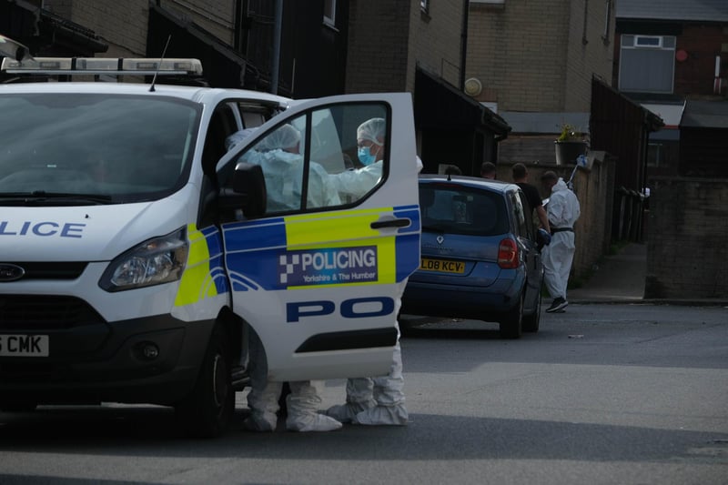 Police at the scene of a murder investigation on George Street, Worsbrough, Barnsley