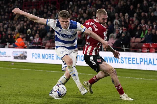 Oli McBurnie of Sheffield United with Rob Dickie of QPR: Andrew Yates / Sportimage