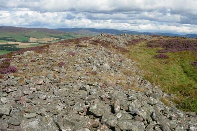 These Iron Age hill top settlements give tremendous sense of scale and space and afford an impressive panorama of the Highland line. Colours refer to the heather-covered turf and stone of one and the massive collapsed ramparts of the White. Sit here for a while and picture the Pict.