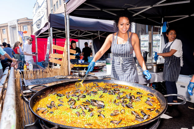 Southsea Food Festival 2019 at Palmerston Road, Southsea - Jess Peters prepares seafood paella at Mr G's Seafood Shack. Picture: Vernon Nash 200719-010