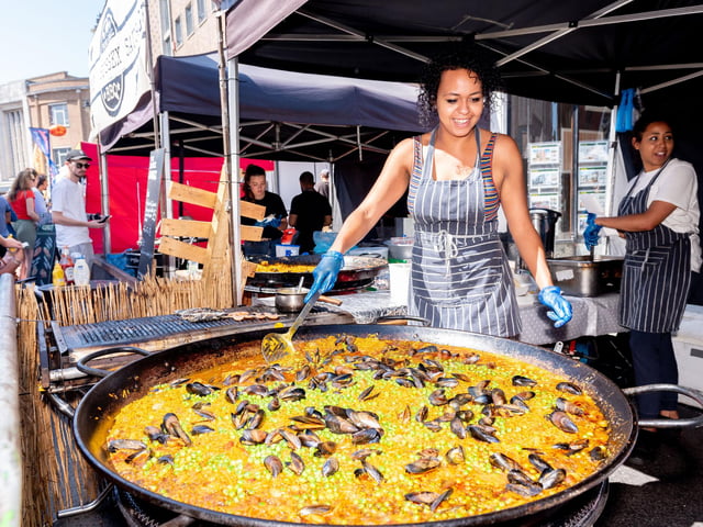 Southsea Food Festival 2019 at Palmerston Road, Southsea - Jess Peters prepares seafood paella at Mr G's Seafood Shack. Picture: Vernon Nash 200719-010