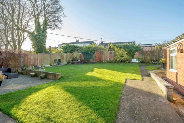 The back garden at the £330,000 property is so spacious and flexible that it's suitable for both relaxing and playing.