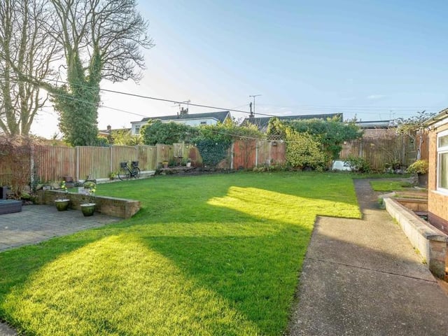 The back garden at the £330,000 property is so spacious and flexible that it's suitable for both relaxing and playing.