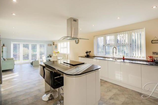 Catch the kitchen from another angle, and marvel at the room available. As well as two integrated ovens, there is a built-in dishwasher and space for a fridge freezer.