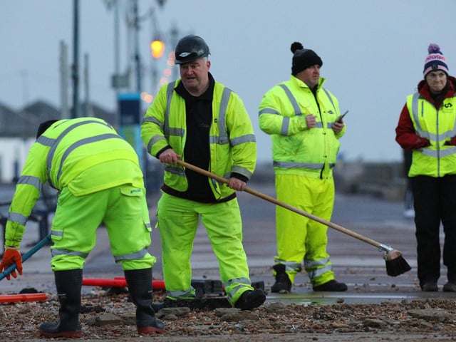 Colas contractors, working on behalf of the city council, clear up on Clarence Esplanade, Southsea, after Storm Barra. Picture: Chris Moorhouse   (jpns 071221-13)
